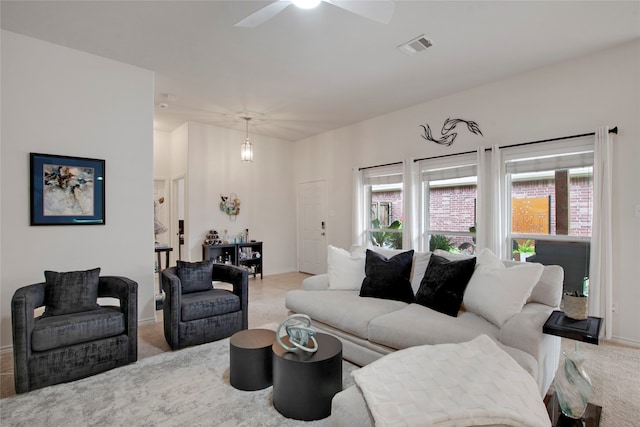 7585 Glasshouse Walk, Frisco, TX 75035 - living room featuring light colored carpet, healthy amount of natural light, and a ceiling fan