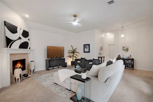 7585 Glasshouse Walk, Frisco, TX 75035 - living area with carpet flooring, ceiling fan, and a tiled fireplace