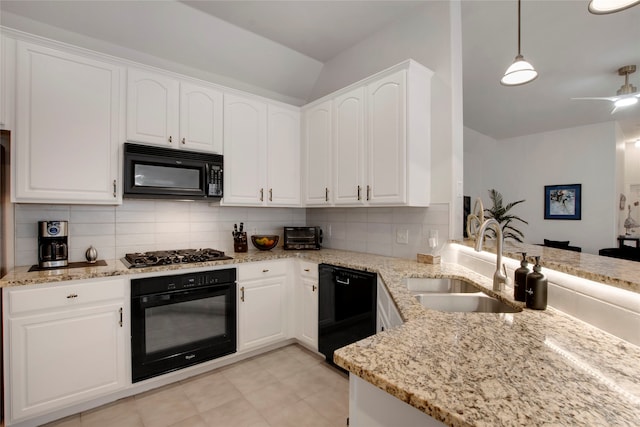 7585 Glasshouse Walk, Frisco, TX 75035 - kitchen featuring black appliances, backsplash, light stone counters, and white cabinets