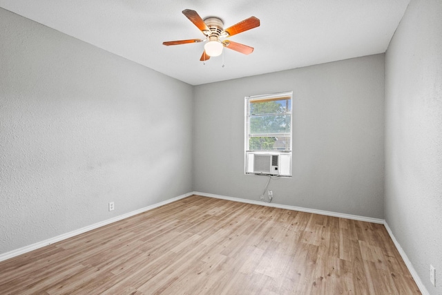 701 W Hull St Unit 101-2, Denison, TX 75020 - spare room featuring light wood-style floors, cooling unit, and ceiling fan