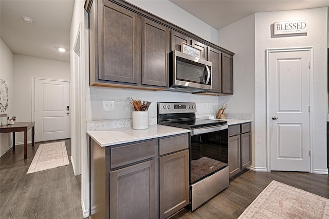 505 Cistern Way, Royse City, TX 75189 - kitchen featuring stainless steel appliances, dark wood-style floors, dark brown cabinets, and recessed lighting