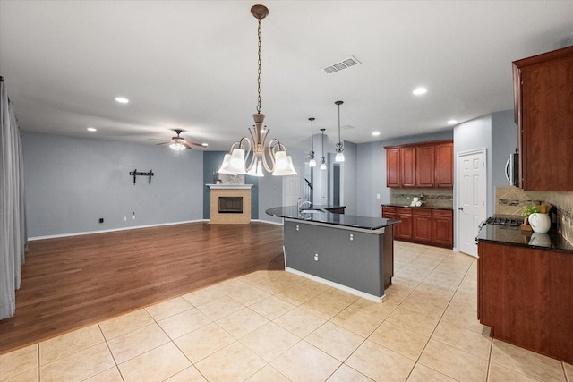 9324 Shadowfax Dr, Arlington, TX 76002 - kitchen featuring dark countertops, recessed lighting, light tile patterned flooring, a ceiling fan, and tasteful backsplash