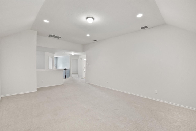 9324 Shadowfax Dr, Arlington, TX 76002 - unfurnished living room with lofted ceiling, recessed lighting, and light colored carpet