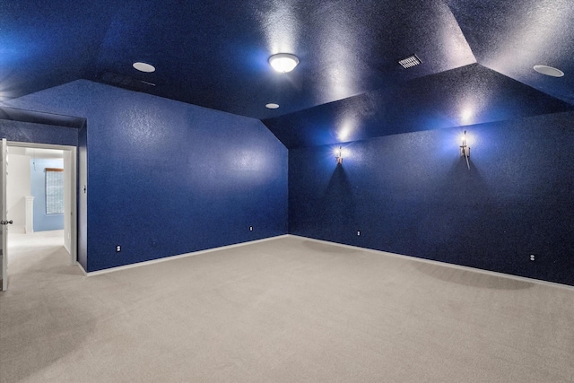 9324 Shadowfax Dr, Arlington, TX 76002 - home theater featuring vaulted ceiling and carpet