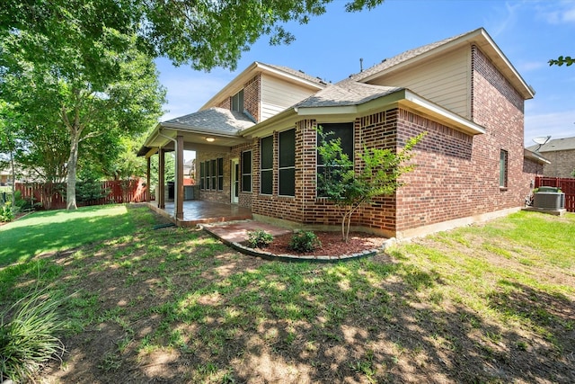 9324 Shadowfax Dr, Arlington, TX 76002 - rear view of property with a patio area, a fenced backyard, brick siding, and a shingled roof