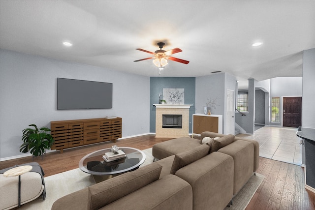 9324 Shadowfax Dr, Arlington, TX 76002 - living room featuring ceiling fan, wood finished floors, a tile fireplace, and recessed lighting
