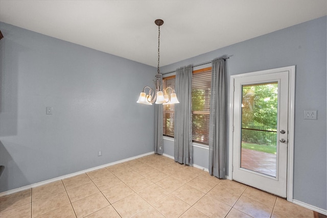 9324 Shadowfax Dr, Arlington, TX 76002 - unfurnished dining area featuring a chandelier and light tile patterned floors