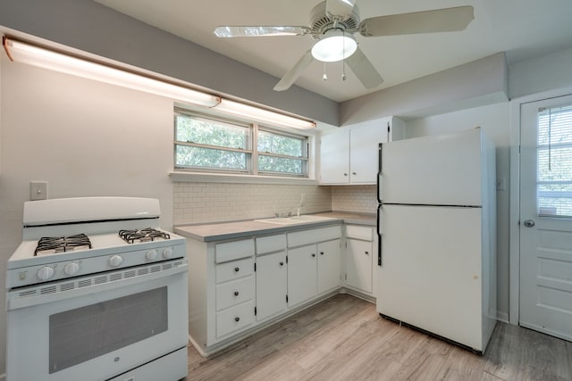 2442 Oates Dr, Dallas, TX 75228 - kitchen featuring white appliances, light countertops, decorative backsplash, and healthy amount of natural light