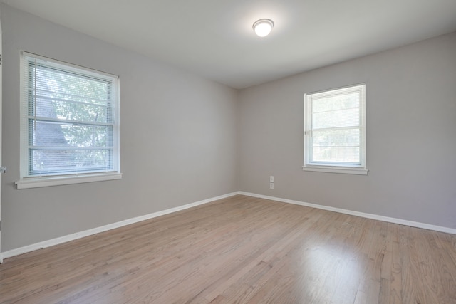 2442 Oates Dr, Dallas, TX 75228 - empty room with wood finished floors and baseboards