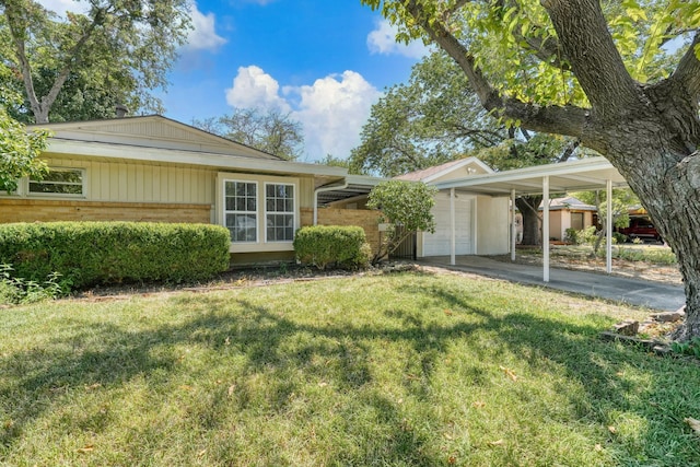 2442 Oates Dr, Dallas, TX 75228 - view of grassy yard featuring a carport and driveway