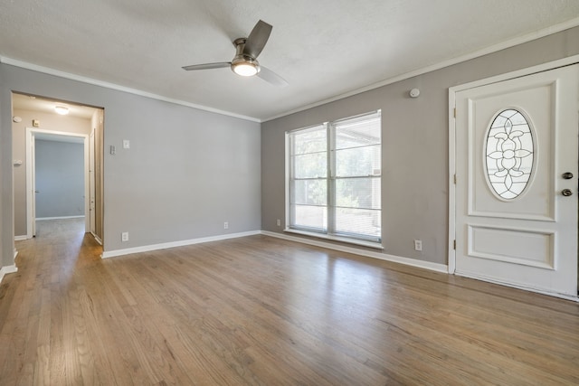 2442 Oates Dr, Dallas, TX 75228 - foyer entrance featuring ornamental molding, a ceiling fan, and wood finished floors