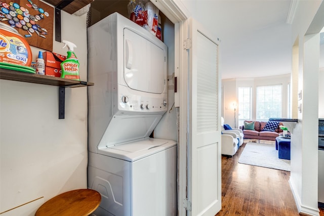 3208 Cole Ave Unit 1110, Dallas, TX 75204 - laundry area with stacked washer / drying machine and wood finished floors