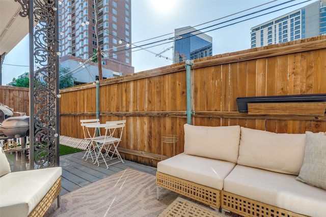 3208 Cole Ave Unit 1110, Dallas, TX 75204 - wooden deck with outdoor lounge area