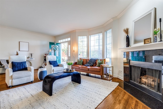 3208 Cole Ave Unit 1110, Dallas, TX 75204 - living room with wood finished floors, ornamental molding, plenty of natural light, and a tiled fireplace