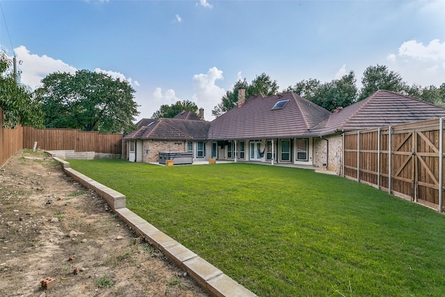 3713 Brentwood Ct, Colleyville, TX 76034 - rear view of property with a hot tub, a fenced backyard, a chimney, a tile roof, and brick siding