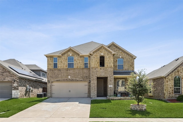 1344 Mountain View Ln, Kennedale, TX 76060 - view of front of property featuring driveway, a front lawn, a garage, stone siding, and brick siding