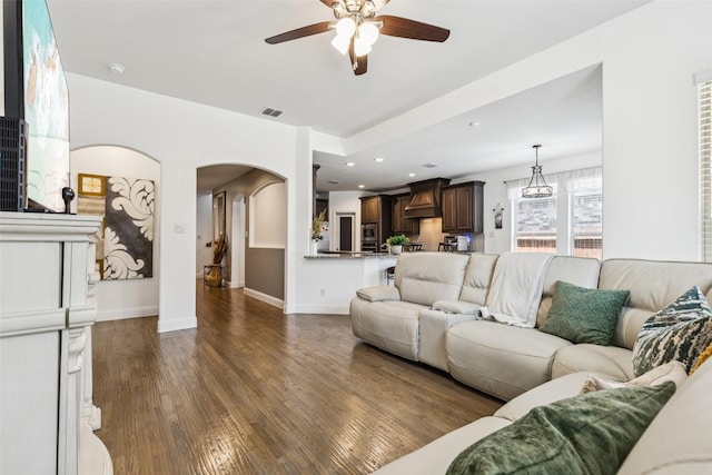 1344 Mountain View Ln, Kennedale, TX 76060 - living area featuring ceiling fan, dark wood-style floors, arched walkways, and recessed lighting