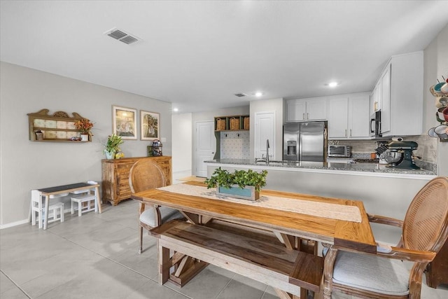 2525 Bunkerton Dr, Fort Worth, TX 76179 - dining area with recessed lighting and light tile patterned floors