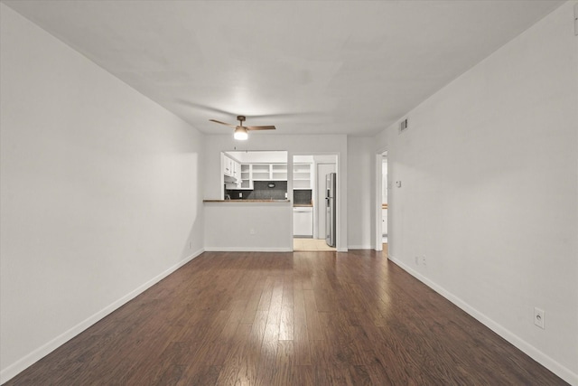 5305 Fleetwood Oaks Dr Unit 274, Dallas, TX 75235 - unfurnished living room featuring a ceiling fan and dark wood-style floors