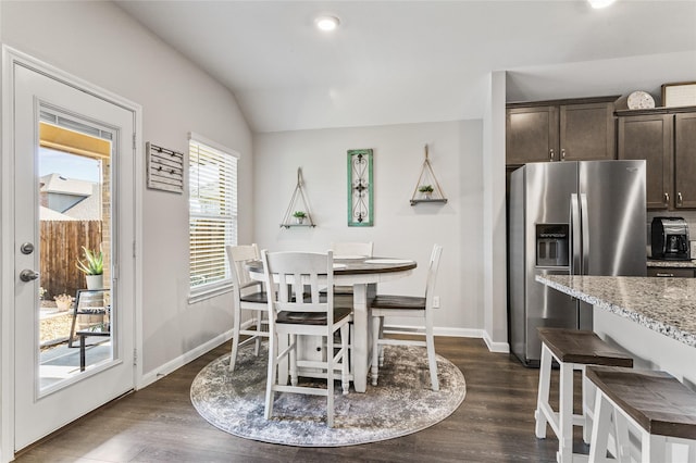 702 Stampede Ln, Princeton, TX 75407 - dining space featuring vaulted ceiling and dark wood-style floors