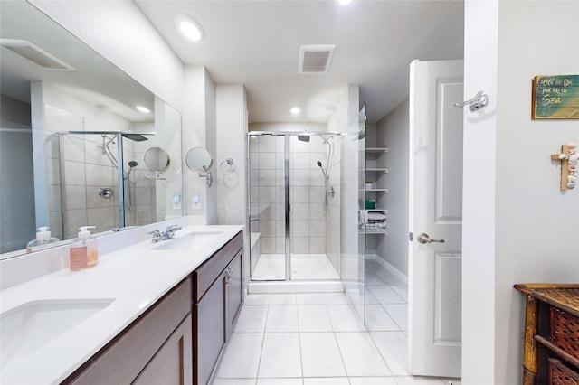 702 Stampede Ln, Princeton, TX 75407 - bathroom with tile patterned floors, a shower stall, double vanity, and recessed lighting