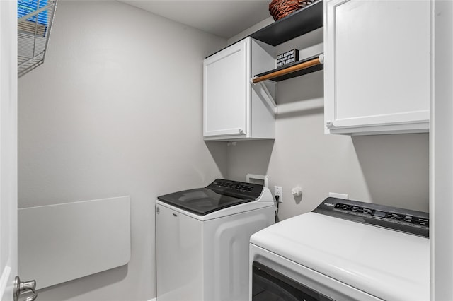 702 Stampede Ln, Princeton, TX 75407 - laundry area with independent washer and dryer and cabinet space