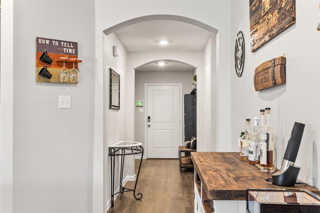 702 Stampede Ln, Princeton, TX 75407 - hall featuring dark wood finished floors and arched walkways