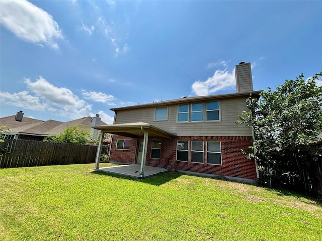 150 Wandering Dr, Forney, TX 75126 - rear view of property with a patio, brick siding, and a chimney