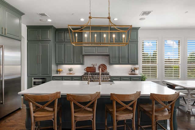 2223 Galloway Blvd, Trophy Club, TX 76262 - kitchen with stainless steel built in refrigerator, green cabinetry, light countertops, dark wood-style flooring, and recessed lighting