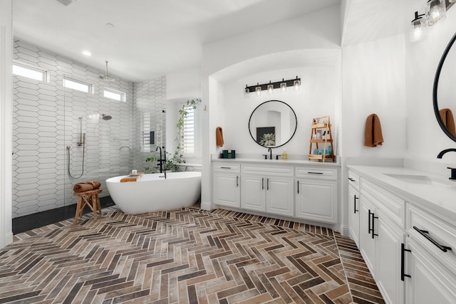 2223 Galloway Blvd, Trophy Club, TX 76262 - bathroom featuring a walk in shower, two vanities, a soaking tub, and brick patterned flooring