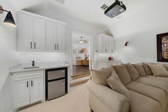 2223 Galloway Blvd, Trophy Club, TX 76262 - living area with vaulted ceiling, a ceiling fan, and light colored carpet