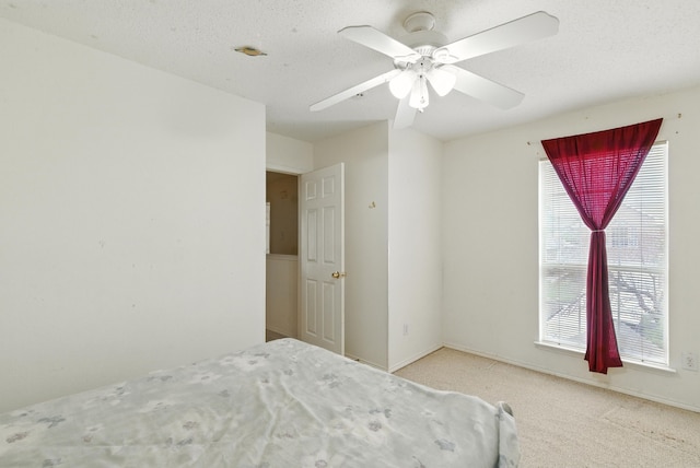 5004 Lodgepole Ln, Fort Worth, TX 76137 - carpeted bedroom featuring multiple windows and ceiling fan