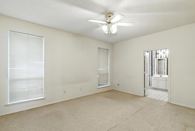 5004 Lodgepole Ln, Fort Worth, TX 76137 - carpeted spare room featuring ceiling fan and a textured ceiling