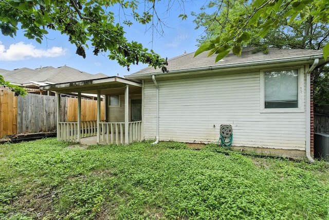 5004 Lodgepole Ln, Fort Worth, TX 76137 - back of house with a fenced backyard and roof with shingles