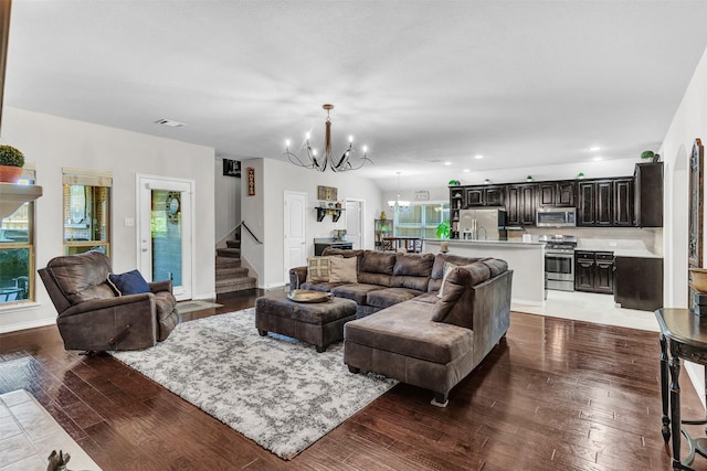 1402 White Water Ln, Rockwall, TX 75087 - living area featuring a chandelier, wood-type flooring, stairs, and recessed lighting
