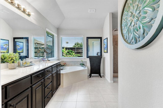 1402 White Water Ln, Rockwall, TX 75087 - bathroom with a bath, double vanity, tile patterned flooring, and lofted ceiling