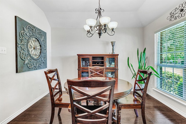 1402 White Water Ln, Rockwall, TX 75087 - dining space with vaulted ceiling, dark wood-type flooring, and a chandelier