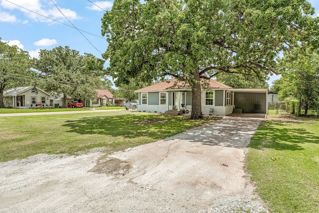 690 S Fifth Ave, Stephenville, TX 76401 - view of front of property with driveway, a front yard, and a carport