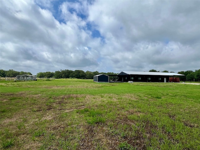 17103 Crk 2830, Mabank, TX 75156 - view of grassy yard with a pole building, a view of rural / pastoral area, and an outdoor structure