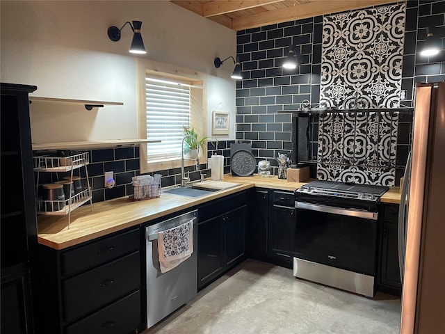 17103 Crk 2830, Mabank, TX 75156 - kitchen featuring stainless steel appliances, wood counters, dark cabinets, concrete flooring, and a wood ceiling with exposed beams