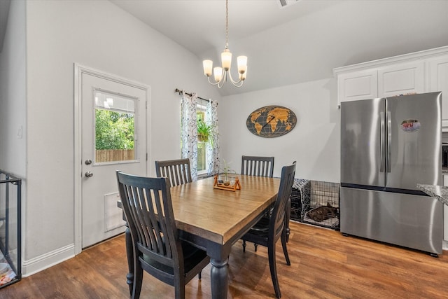 101 Paytons Way, Corsicana, TX 75110 - dining space featuring a chandelier, lofted ceiling, and wood finished floors