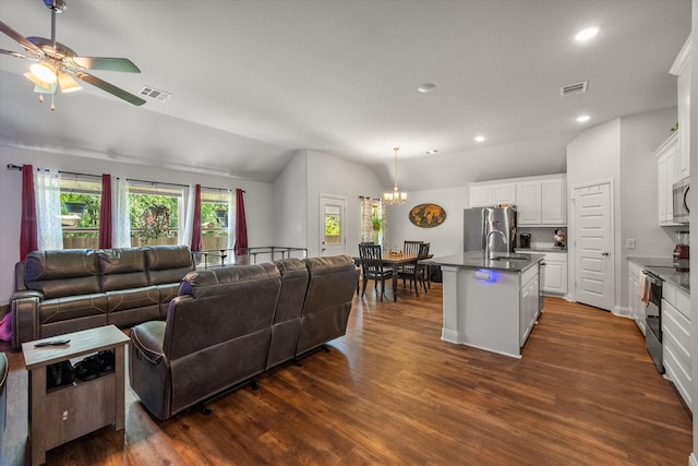101 Paytons Way, Corsicana, TX 75110 - living area featuring lofted ceiling, dark wood-style flooring, a chandelier, recessed lighting, and a ceiling fan