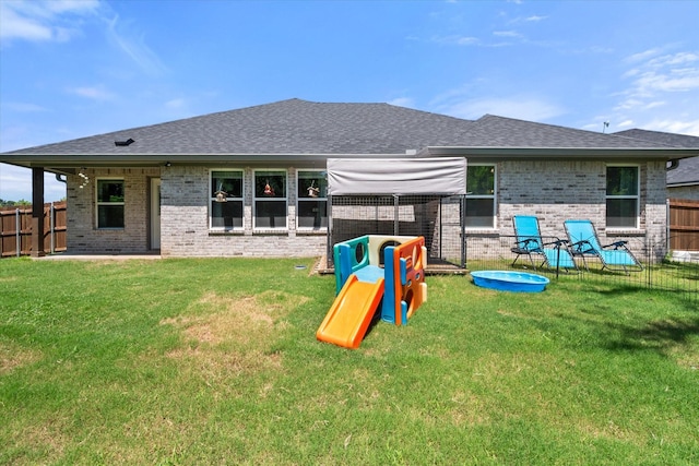 101 Paytons Way, Corsicana, TX 75110 - back of property featuring brick siding, a fenced backyard, and a shingled roof