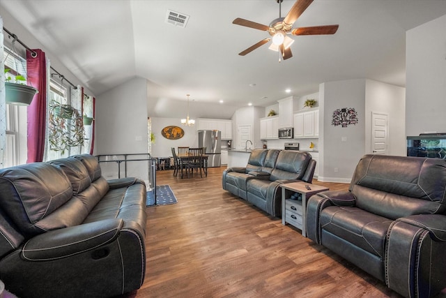 101 Paytons Way, Corsicana, TX 75110 - living room with lofted ceiling, a ceiling fan, wood finished floors, and recessed lighting