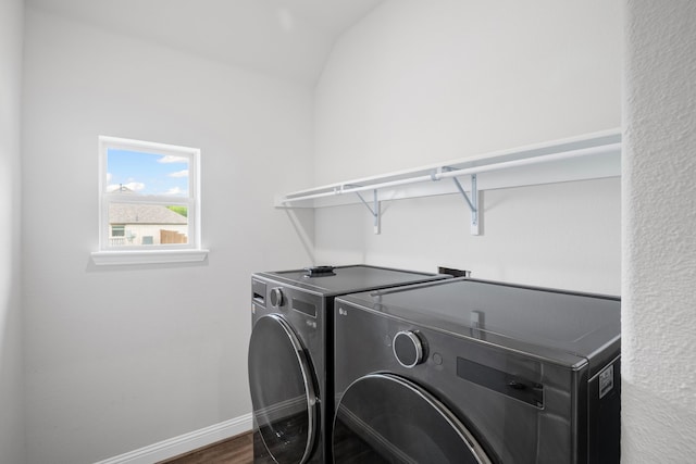 4919 Elizabeth Way, Lone Oak, TX 75453 - washroom with washer and clothes dryer and wood finished floors
