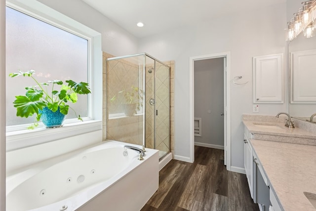 104 Northfield Cir, Hickory Creek, TX 75065 - bathroom with vanity, a shower stall, a whirlpool tub, wood finished floors, and recessed lighting