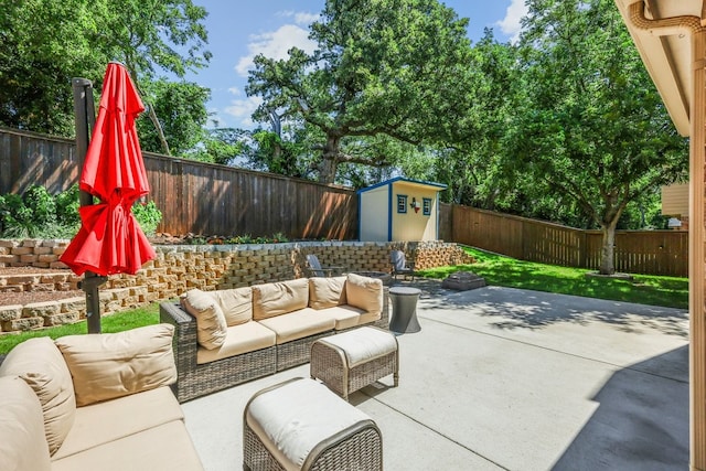 104 Northfield Cir, Hickory Creek, TX 75065 - fenced backyard featuring an outdoor living space, a patio area, and a storage shed