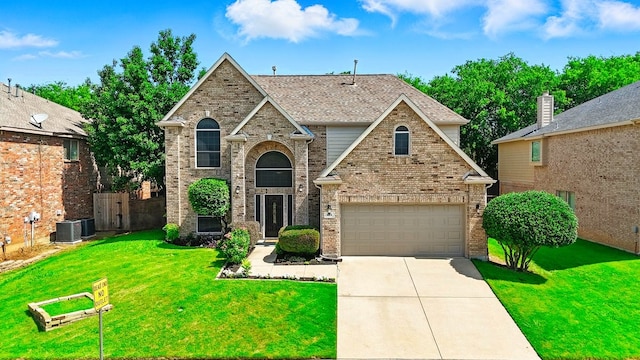 104 Northfield Cir, Hickory Creek, TX 75065 - view of front facade with driveway, brick siding, and an attached garage