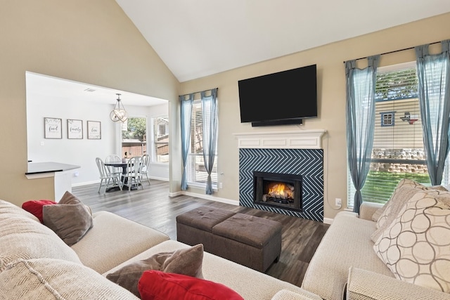 104 Northfield Cir, Hickory Creek, TX 75065 - living area with healthy amount of natural light, wood finished floors, high vaulted ceiling, and a fireplace
