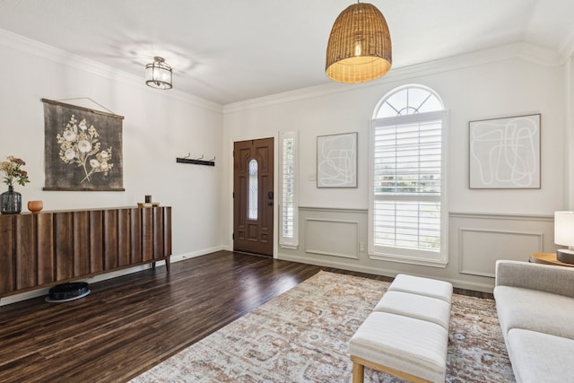 7716 Glenoaks Dr, Frisco, TX 75034 - foyer with wood finished floors, crown molding, and a wainscoted wall